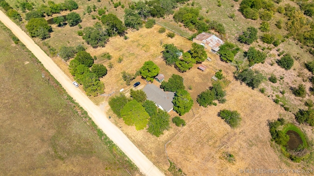 birds eye view of property featuring a rural view