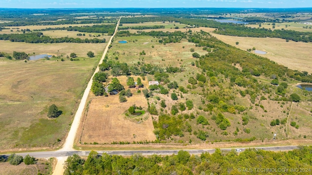 aerial view featuring a water view and a rural view