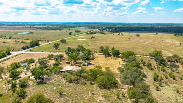 birds eye view of property with a rural view