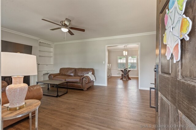 living room with ceiling fan, wood-type flooring, and ornamental molding