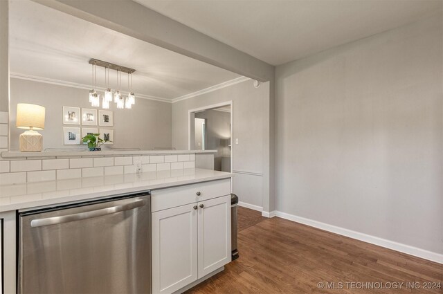 kitchen with hanging light fixtures, dark hardwood / wood-style floors, white cabinetry, and stainless steel dishwasher