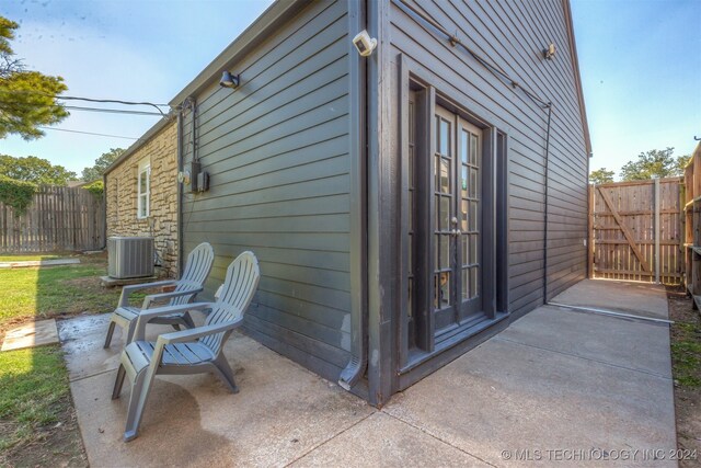 exterior space featuring a patio area and central AC