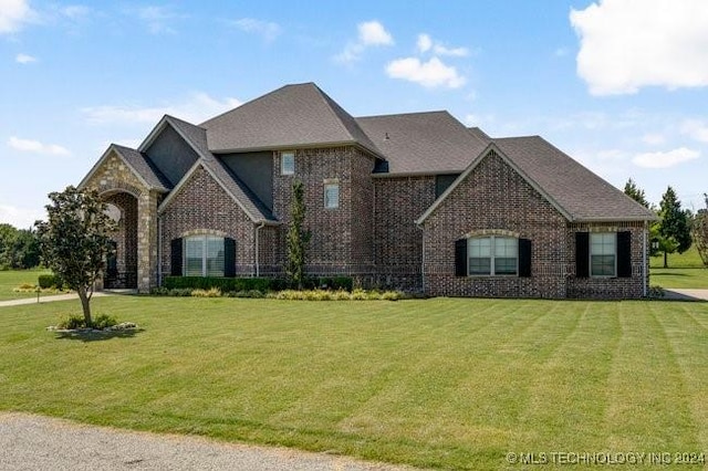3526 Evans Ave, Mannford, OK 74044 - french country inspired facade with brick siding and a front yard