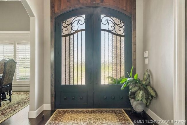 3526 Evans Ave, Mannford, OK 74044 - entryway featuring french doors, arched walkways, healthy amount of natural light, and baseboards