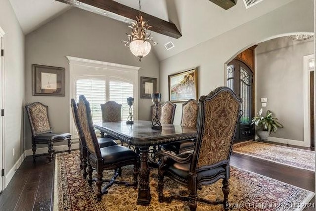 3526 Evans Ave, Mannford, OK 74044 - dining space featuring arched walkways, dark wood finished floors, beam ceiling, baseboards, and high vaulted ceiling