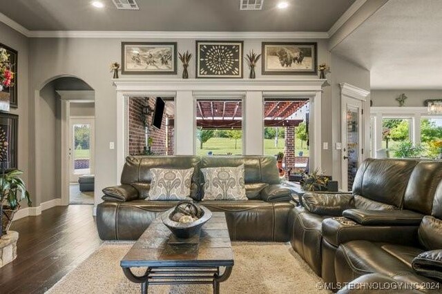 3526 Evans Ave, Mannford, OK 74044 - living area featuring arched walkways, crown molding, hardwood / wood-style floors, healthy amount of natural light, and recessed lighting