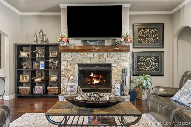 3526 Evans Ave, Mannford, OK 74044 - living room featuring wood finished floors, crown molding, a fireplace, arched walkways, and baseboards