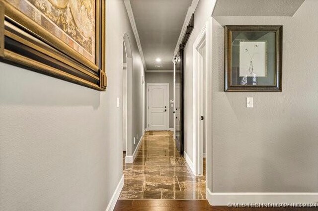 3526 Evans Ave, Mannford, OK 74044 - corridor featuring ornamental molding, baseboards, dark marble finish flooring, and a textured wall