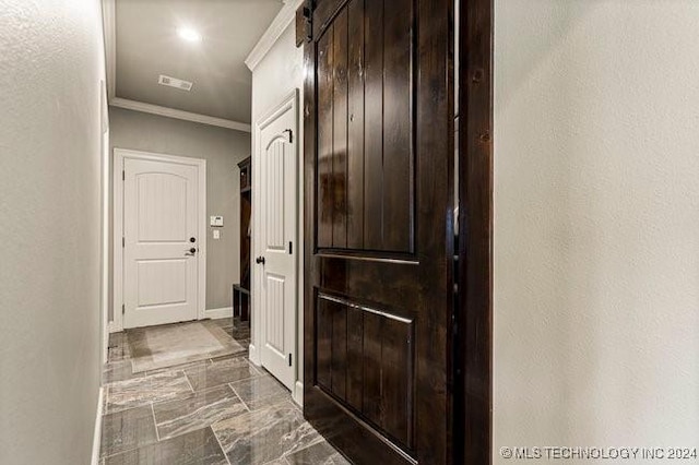 3526 Evans Ave, Mannford, OK 74044 - hall featuring dark marble finish floors, ornamental molding, baseboards, and a barn door