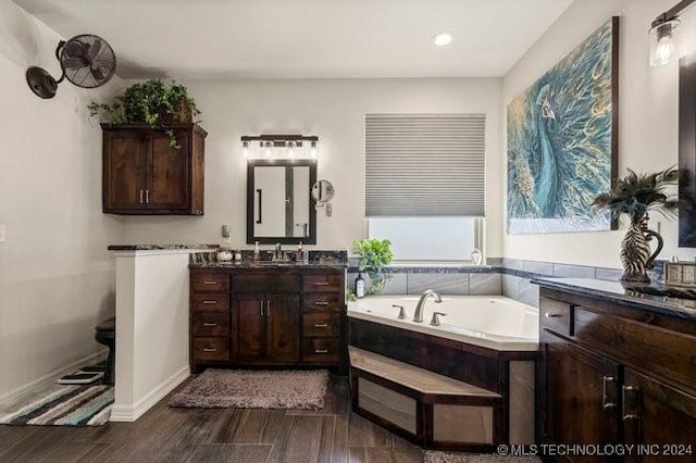 3526 Evans Ave, Mannford, OK 74044 - bathroom featuring wood finished floors, a garden tub, vanity, and recessed lighting
