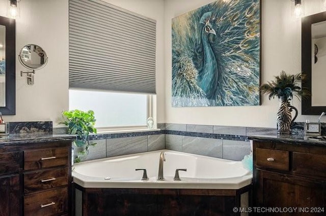 3526 Evans Ave, Mannford, OK 74044 - bathroom featuring a garden tub and vanity