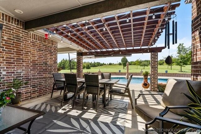 3526 Evans Ave, Mannford, OK 74044 - view of patio / terrace featuring an outdoor pool, a pergola, and outdoor dining space