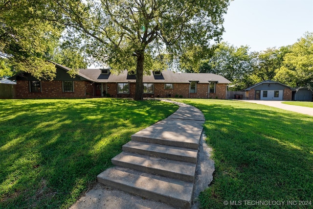 ranch-style house with a front lawn