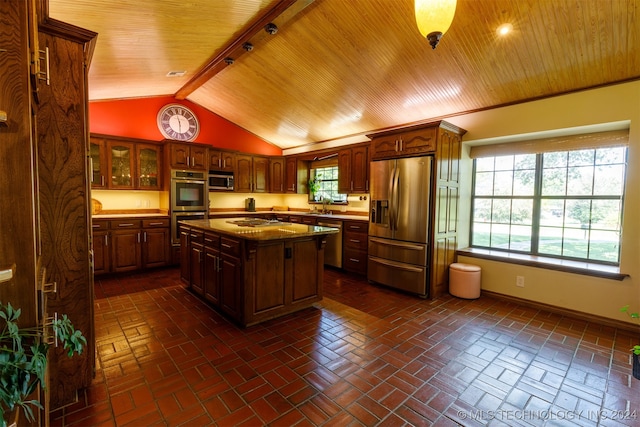 kitchen featuring a kitchen island, stainless steel appliances, wooden ceiling, lofted ceiling, and sink