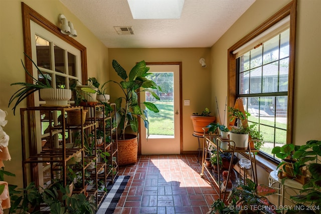 entryway featuring a textured ceiling