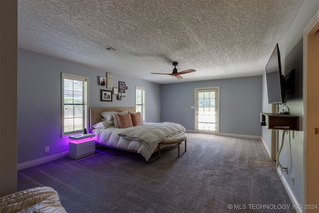 bedroom with carpet, ceiling fan, access to outside, and a textured ceiling