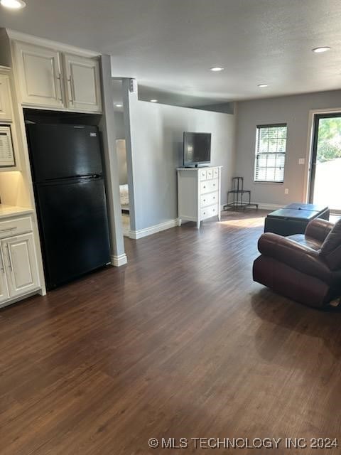 living room featuring dark hardwood / wood-style floors