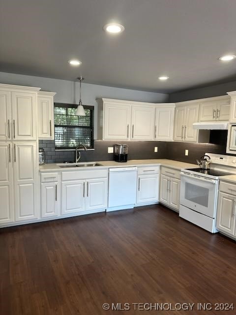 kitchen featuring dark hardwood / wood-style floors, white appliances, sink, and white cabinets