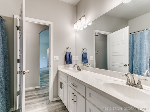 bathroom featuring vanity and hardwood / wood-style flooring