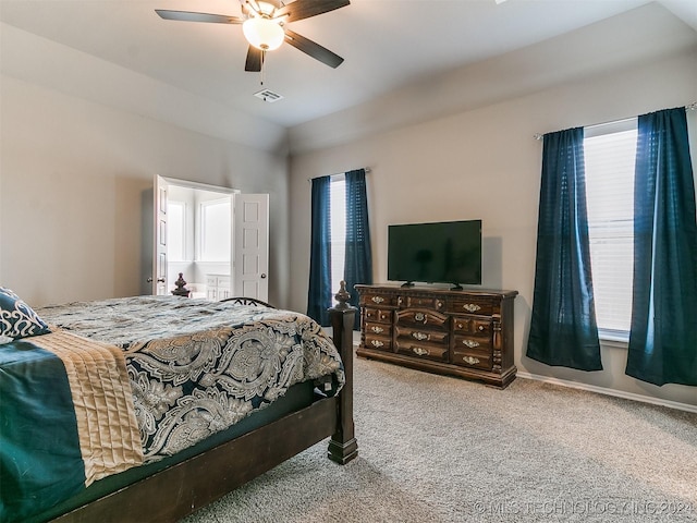 bedroom with visible vents, baseboards, ceiling fan, vaulted ceiling, and carpet floors