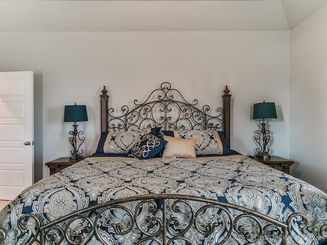 bedroom with vaulted ceiling