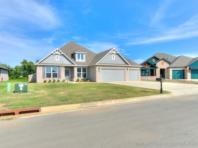 view of front of property with driveway, brick siding, a garage, and a front yard