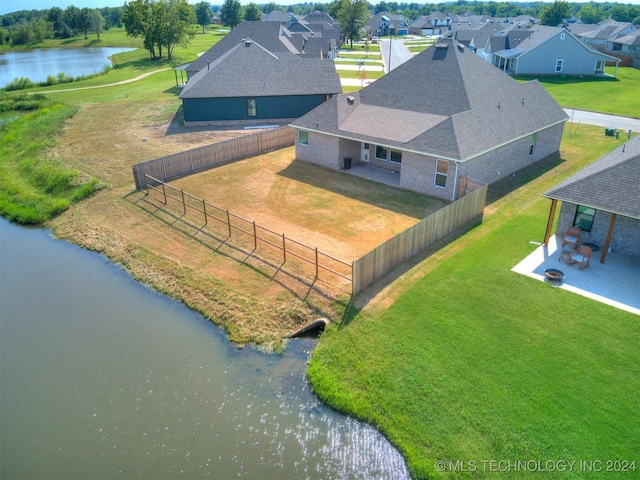 birds eye view of property featuring a residential view and a water view