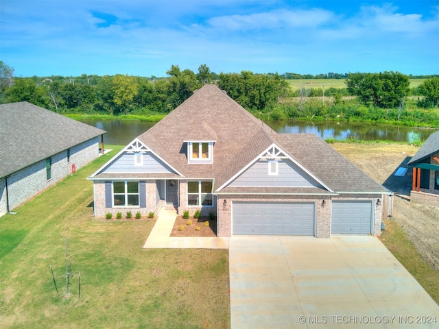 view of front of house featuring a front yard and a water view