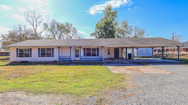 single story home featuring covered porch and a front yard