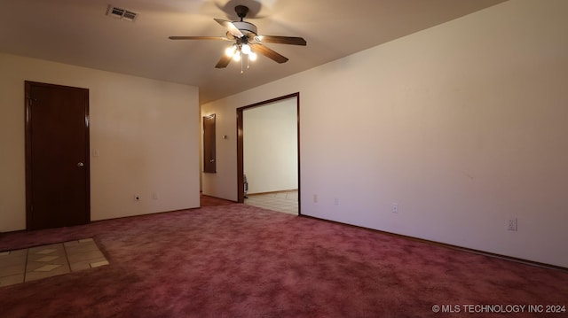 unfurnished bedroom featuring light colored carpet and ceiling fan