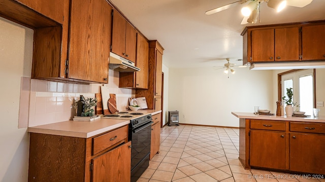 kitchen with black electric range, ceiling fan, light tile patterned floors, and tasteful backsplash