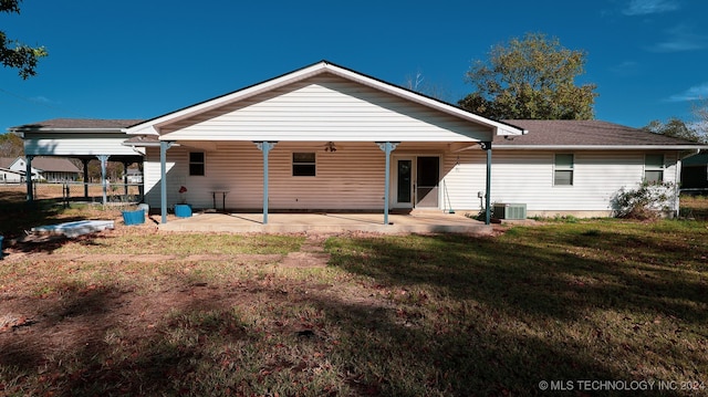 back of house featuring central air condition unit, a patio area, a lawn, and ceiling fan