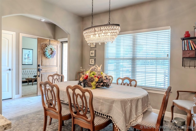 dining space featuring an inviting chandelier