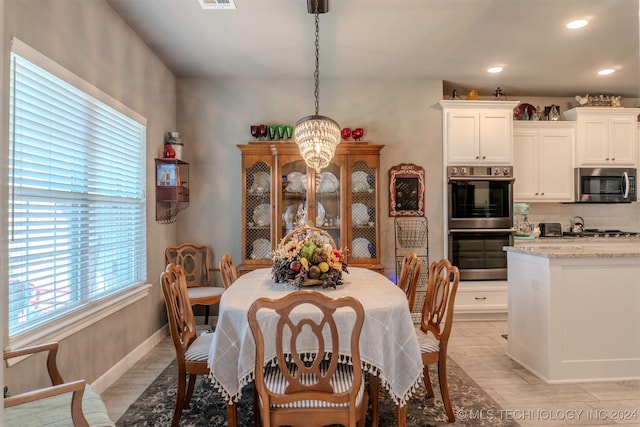 dining space featuring light hardwood / wood-style floors