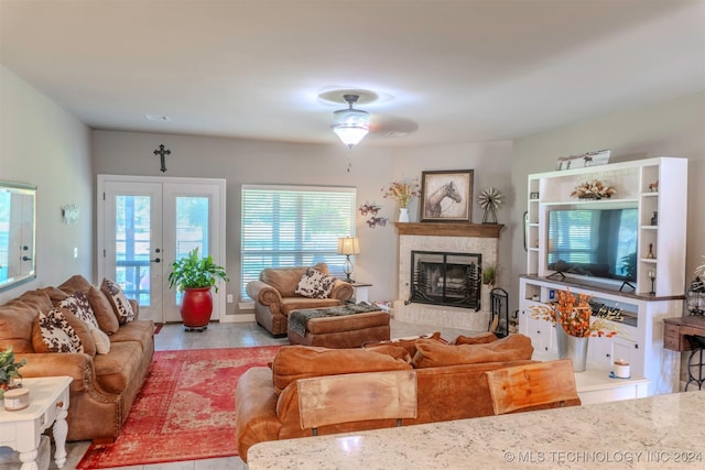 living room with french doors and ceiling fan