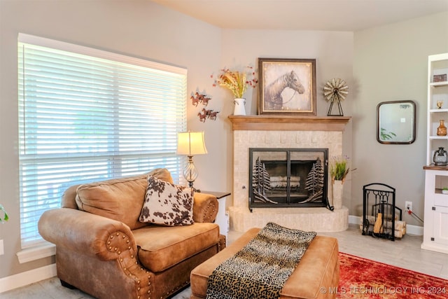 sitting room featuring tile patterned flooring and a healthy amount of sunlight