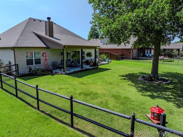 back of property featuring a patio and a lawn