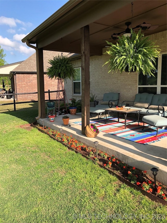 view of patio featuring ceiling fan