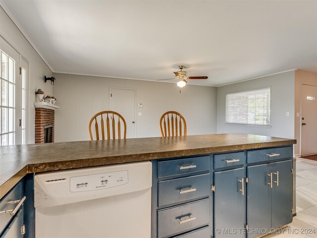 kitchen featuring ceiling fan, white dishwasher, light tile patterned flooring, and blue cabinets