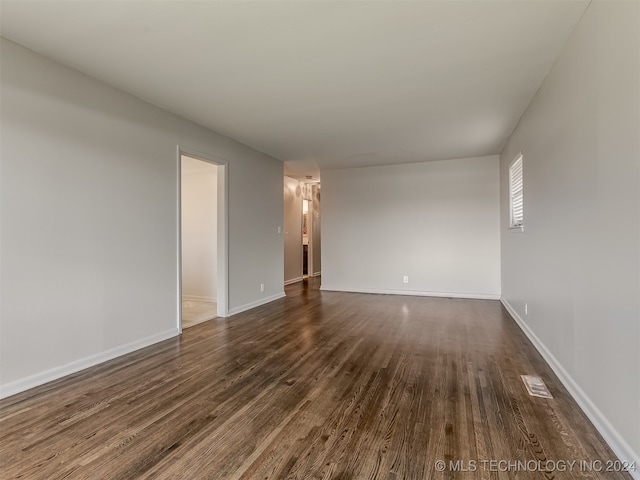 spare room featuring dark hardwood / wood-style floors