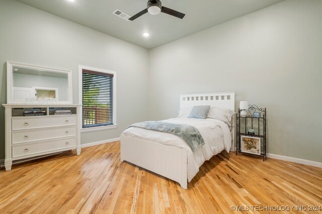 bedroom featuring ceiling fan and light wood-type flooring