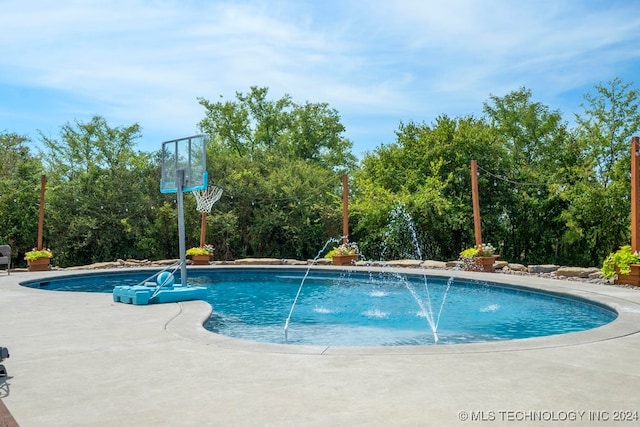 view of swimming pool featuring pool water feature