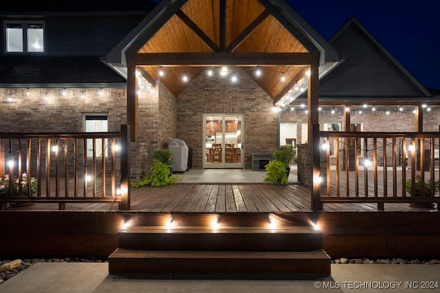 view of front of property featuring a wooden deck and french doors