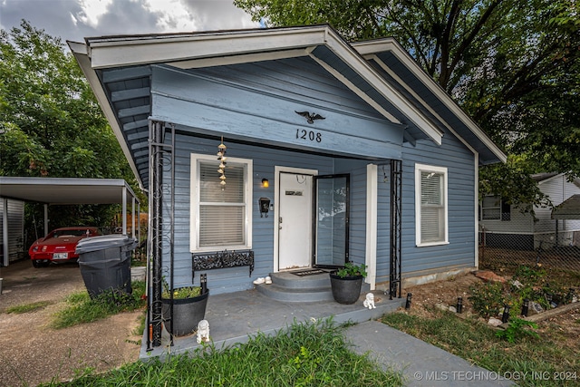 view of front of home with a carport