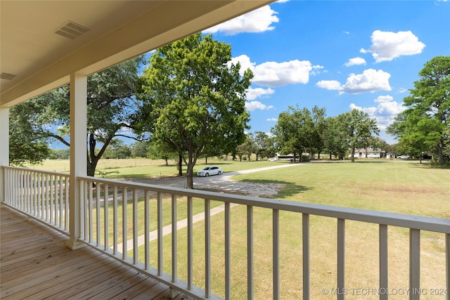 wooden deck with a yard