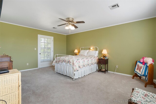 bedroom with carpet, crown molding, and ceiling fan