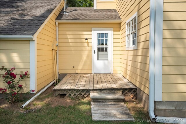 doorway to property with a deck