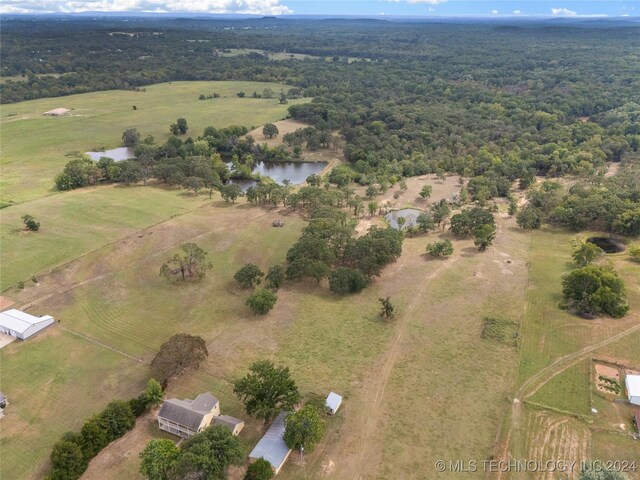 birds eye view of property featuring a water view and a rural view