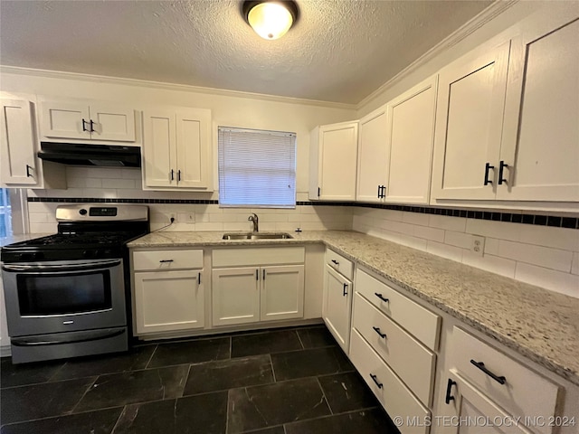 kitchen with ornamental molding, sink, white cabinetry, and stainless steel stove