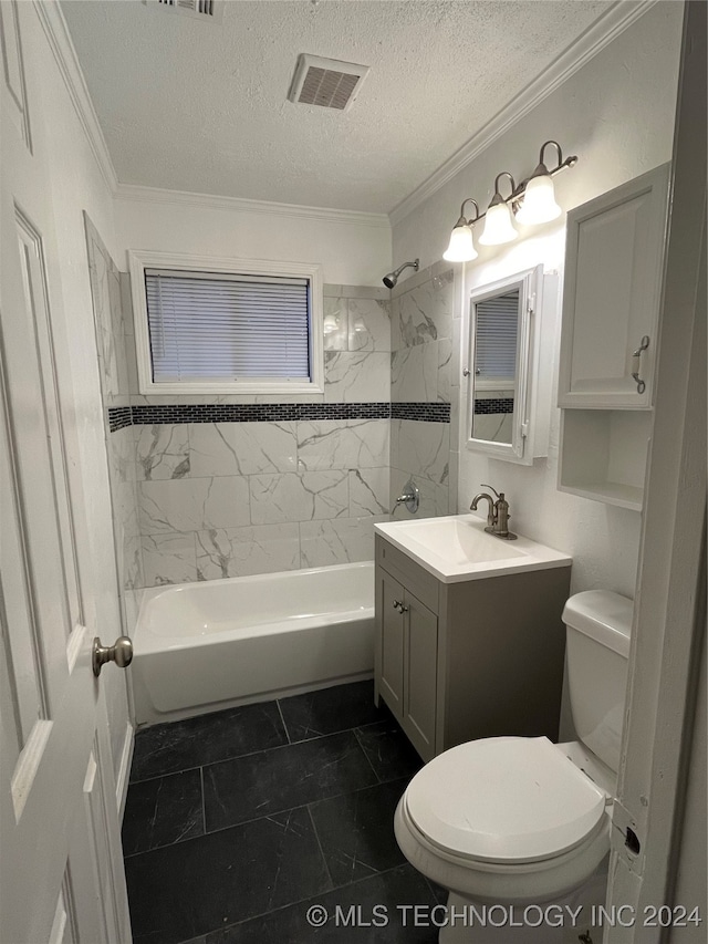 full bathroom featuring tiled shower / bath, vanity, crown molding, and toilet